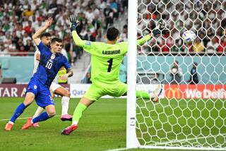 DOHA, QATAR - NOVEMBER 29: Christian Pulisic of United States scores their team's first goal past Alireza Beiranvand of IR Iran during the FIFA World Cup Qatar 2022 Group B match between IR Iran and USA at Al Thumama Stadium on November 29, 2022 in Doha, Qatar. (Photo by Stuart Franklin/Getty Images)