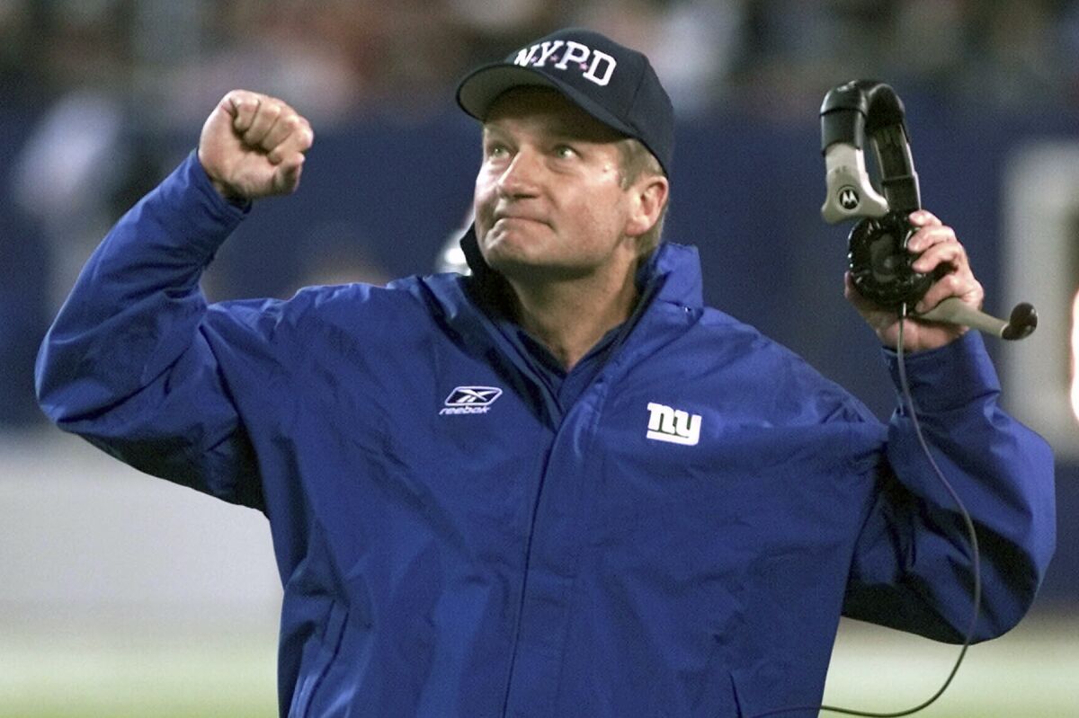 New York Giants coach Jim Fassel reacts to a referee's call in 2001. 