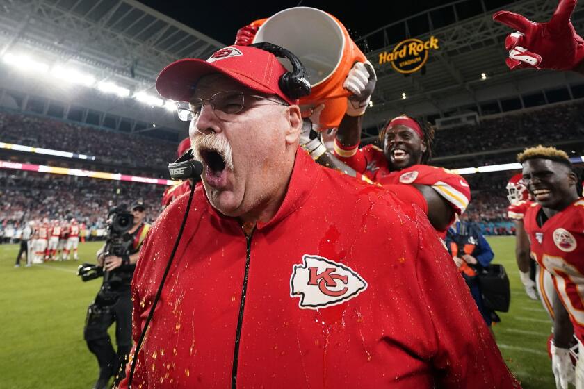 Kansas City Chiefs head coach Andy Reid reacts after being doused during the second half of the NFL Super Bowl 54 football game against the San Francisco 49ers Sunday, Feb. 2, 2020, in Miami Gardens, Fla. (AP Photo/David J. Phillip)