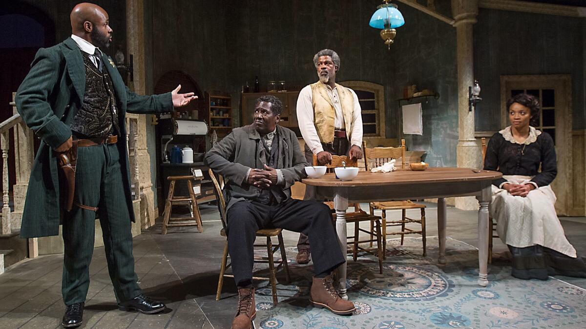 Cast members, from left to right, Arnell Powell, Cleavant Derricks, Matt Ordua and Shinelle Azoroh during rehearsal for August Wilson's "Gem of the Ocean" at South Coast Repertory in Costa Mesa.