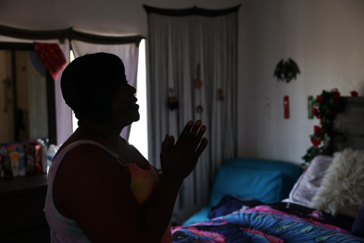 Foster parent Monique in bedroom