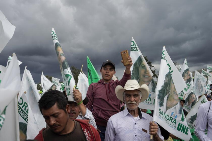 Supporters wait for Sandra Torres, presidential candidate of the UNE party, during a campaign rally in Chimaltenango, Guatemala, Sunday, Aug. 13, 2023. Torres will face Bernardo Arévalo of the Seed Movement party in an Aug. 20 runoff election. (AP Photo/Moises Castillo)