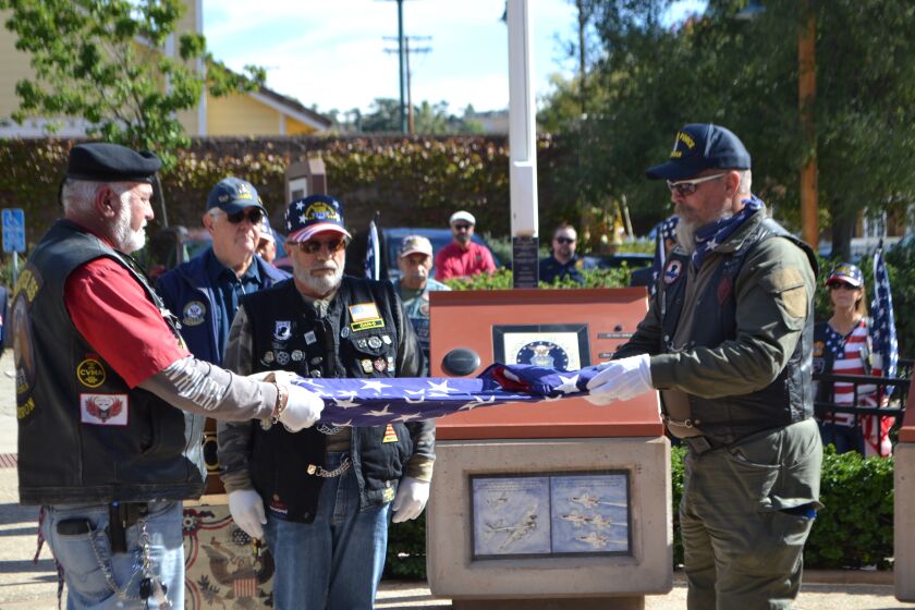 Members of the Patriot Guard Riders conduct a flag ceremony at Poway's Veterans Park on Friday morning.