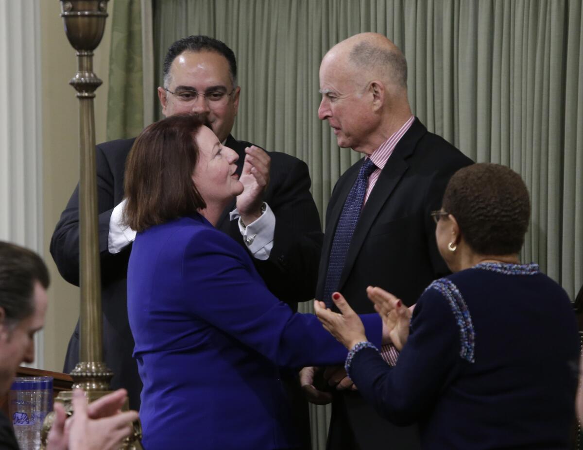 Assembly Speaker Toni Atkins (D-San Diego), pictured here with Gov. Jerry Brown shortly after being sworn into her new leadership role last year, detailed new budget priorities for her caucus Tuesday.