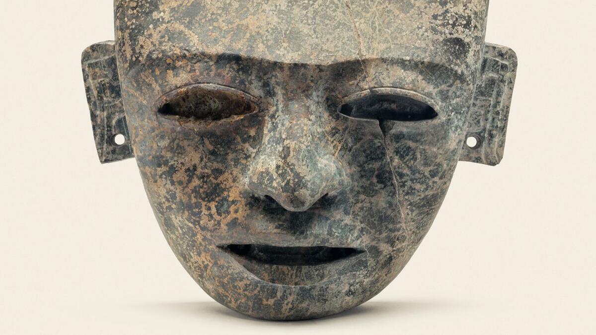 An ancient mask on display as part of LACMA's "City and Cosmos: The Arts of Teotihuacan" exhibition.