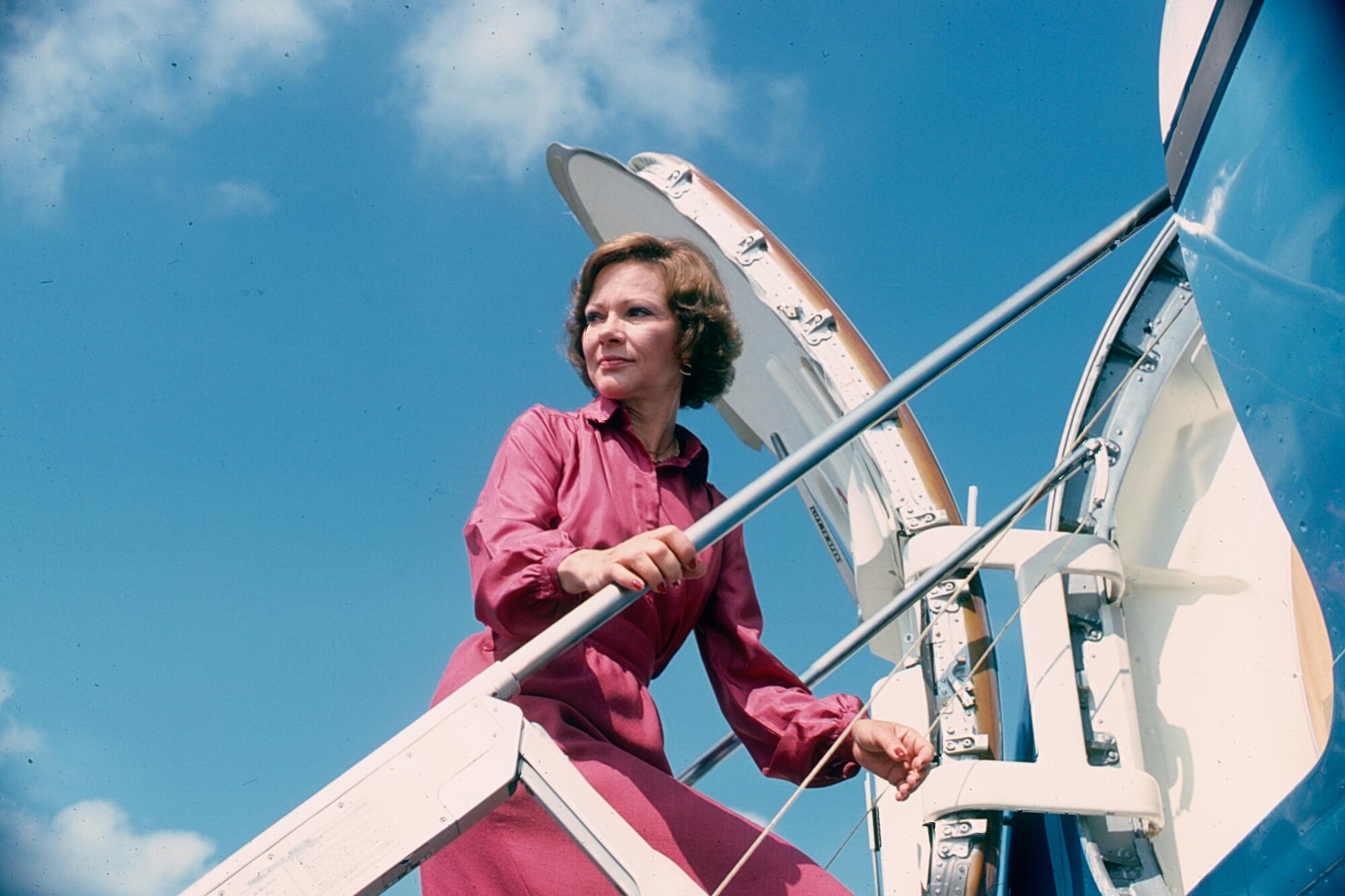 First  Lady Rosalynn Carter climbs into a plane.