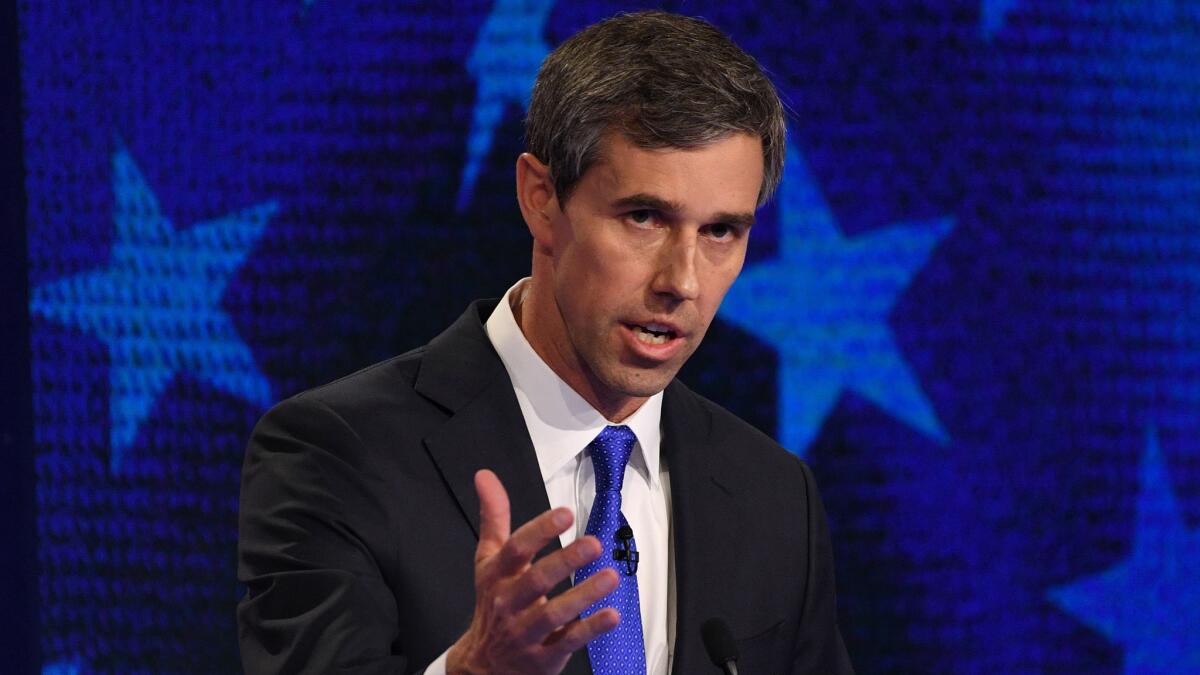Former Texas congressman Beto O’Rourke ditched his signature, rolled-up sleeves style and did, indeed, wear a necktie. (Jim Watson / AFP/Getty Images)