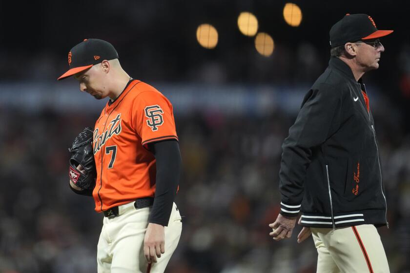 San Francisco Giants pitcher Blake Snell (7) walks off the mound past manager Bob Melvin, right, during a pitching change in the fifth inning of the team's baseball game against the Arizona Diamondbacks in San Francisco, Friday, April 19, 2024. (AP Photo/Jeff Chiu)