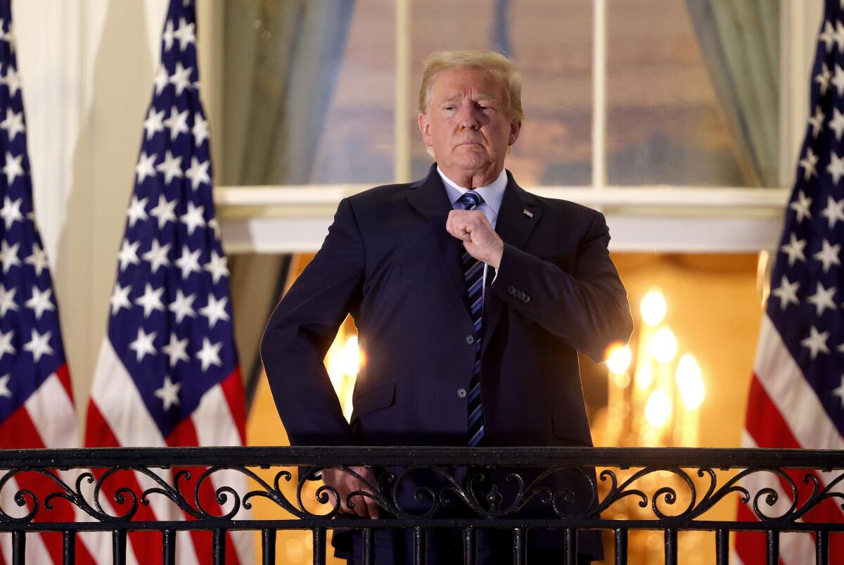 President Trump on the Truman Balcony after returning to the White House