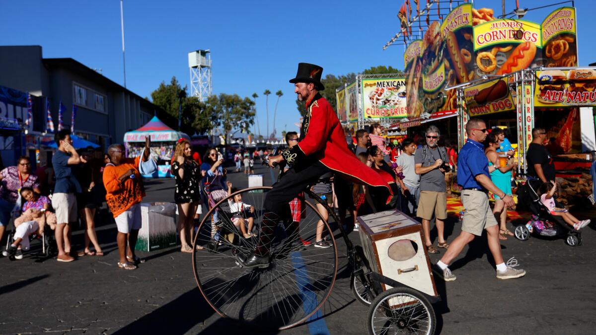 A parade makes its way through the L.A. County Fair at the Fairplex in Pomona.