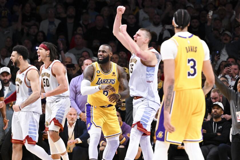 LOS ANGELES, CA - MAY 22: Los Angeles Lakers forward LeBron James, center, reacts after losing game.