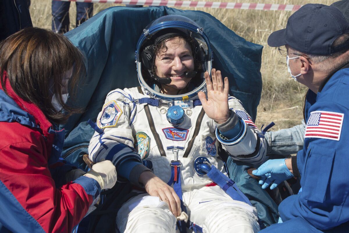 U.S. astronaut Jessica Meir waves shortly after the landing of the Russian Soyuz MS-15 space capsule near Kazakh town of Dzhezkazgan, Kazakhstan on April 17, 2020. An International Space Station crew has landed safely after more than 200 days in space.