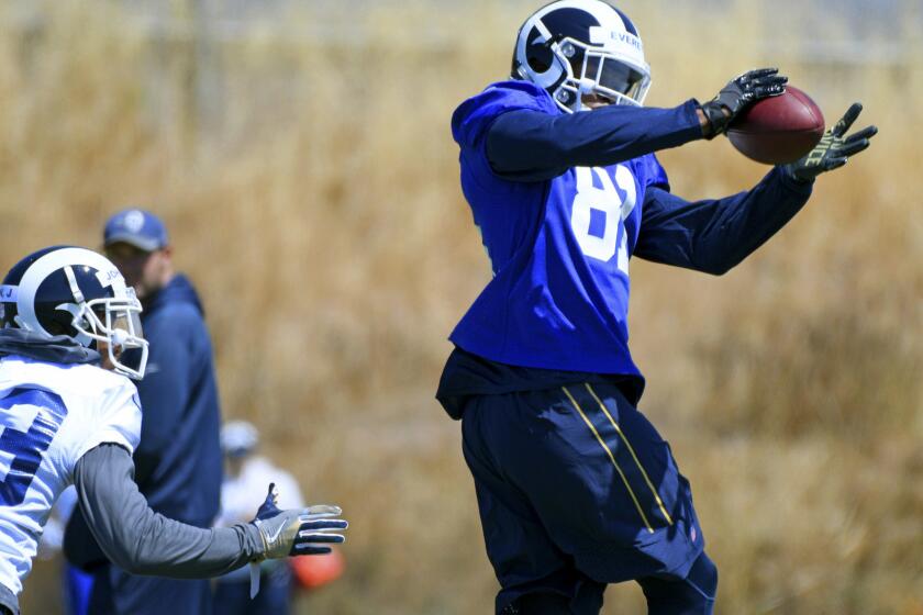 Los Angeles Rams tight end Gerald Everett (81) catches a pass as safety John Johnson (43) defends during NFL football rookie minicamp at the team's practice facility in Thousand Oaks, Calif., Friday, May 12, 2017. (AP Photo/Michael Owen Baker)