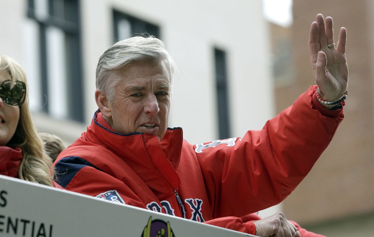 Boston Red Sox president of baseball operations Dave Dombrowski waves during the 2018 World Series parade