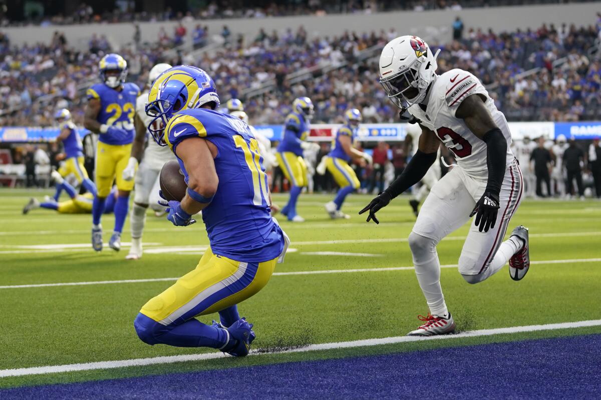 Rams wide receiver Cooper Kupp catches a touchdown pass in front of Arizona Cardinals cornerback Kei'Trel Clark.