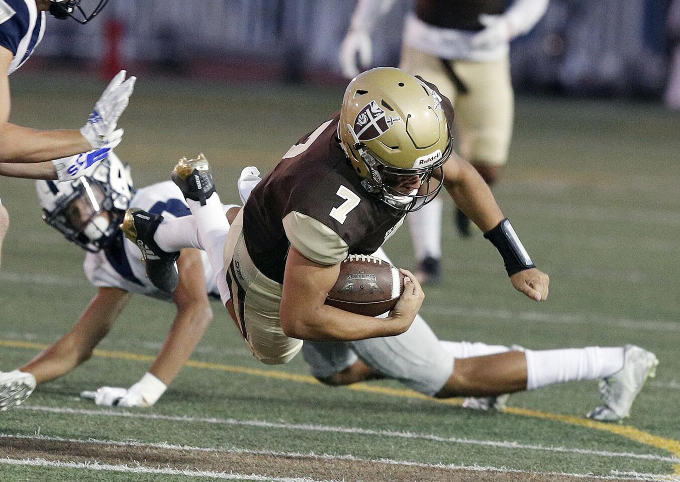 St. Francis' quarterback Darius Perrantes keeps the ball and runs for a lot of yards against Saugus in a non-league football game at St. Francis High School on Friday, September 14, 2018.