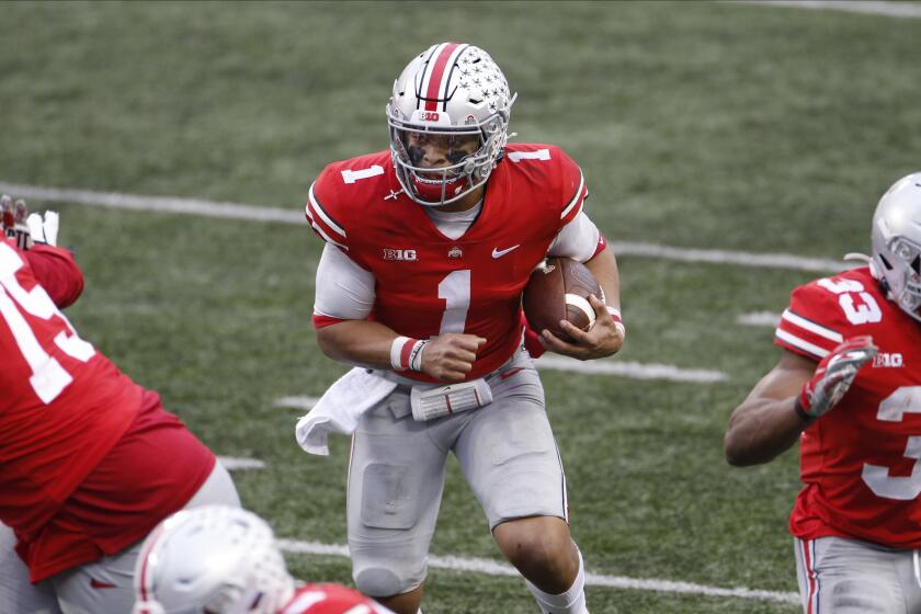 Ohio State quarterback Justin Fields carries the ball against Indiana on Nov. 21, 2020, in Columbus, Ohio.