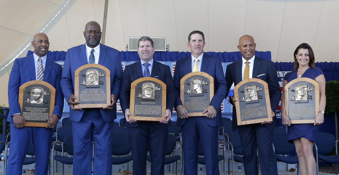 Inductees (from left) Harold Baines, Lee Smith, Edgar Martinez, Mike Mussina, Mariano Rivera and Brandy Halladay, wife the late Roy Halladay, pose with their plaques during the Baseball Hall of Fame induction ceremony at Clark Sports Center on July 21, 2019 in Cooperstown, New York.