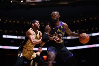 LeBron James #23 of the Los Angeles Lakers dribbles the ball during the game against the Raptors on April 2, 2024 in Toronto.