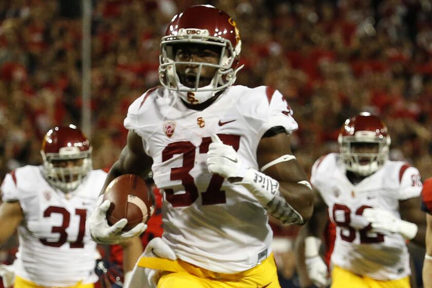 USC running back Javorius Allen scores a touchdown during the Trojans' 28-26 win over Arizona on Saturday.