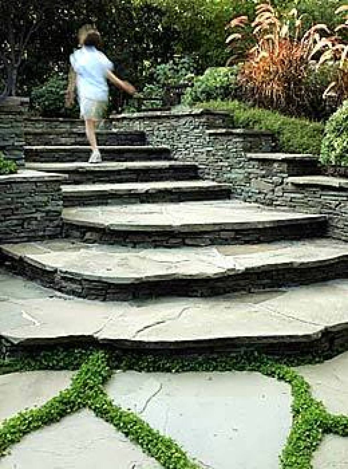 Stone steps lead to the home of Jessica Teich and Michael Gendler in Pacific Palisades. By the time you get to the door, youve had a moment to gather yourself, Teich says.