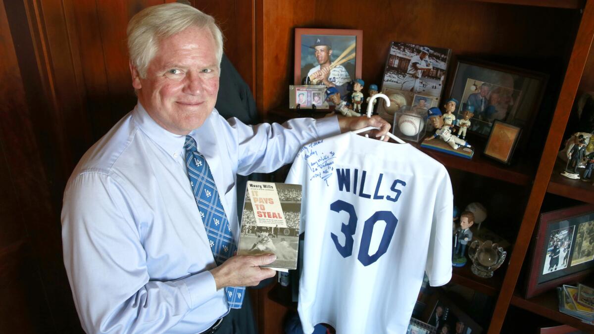 Judge Andrew J. Guilford's displays some of the Maury Wills memorabilia in his chambers at the Ronald Reagan Federal Building and Courthouse in Santa Ana.