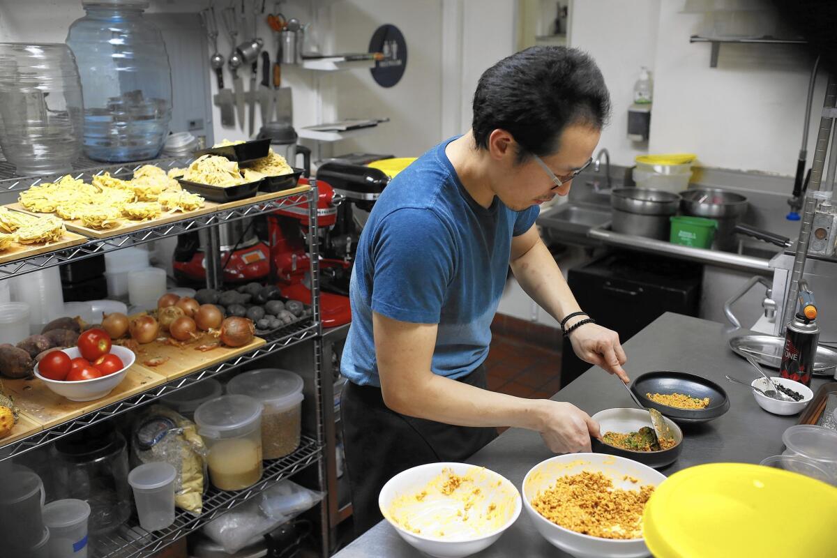Chef Kwang Uh prepares a meal at Baroo, his James Beard Award-nominated restaurant located in a Hollywood strip mall.