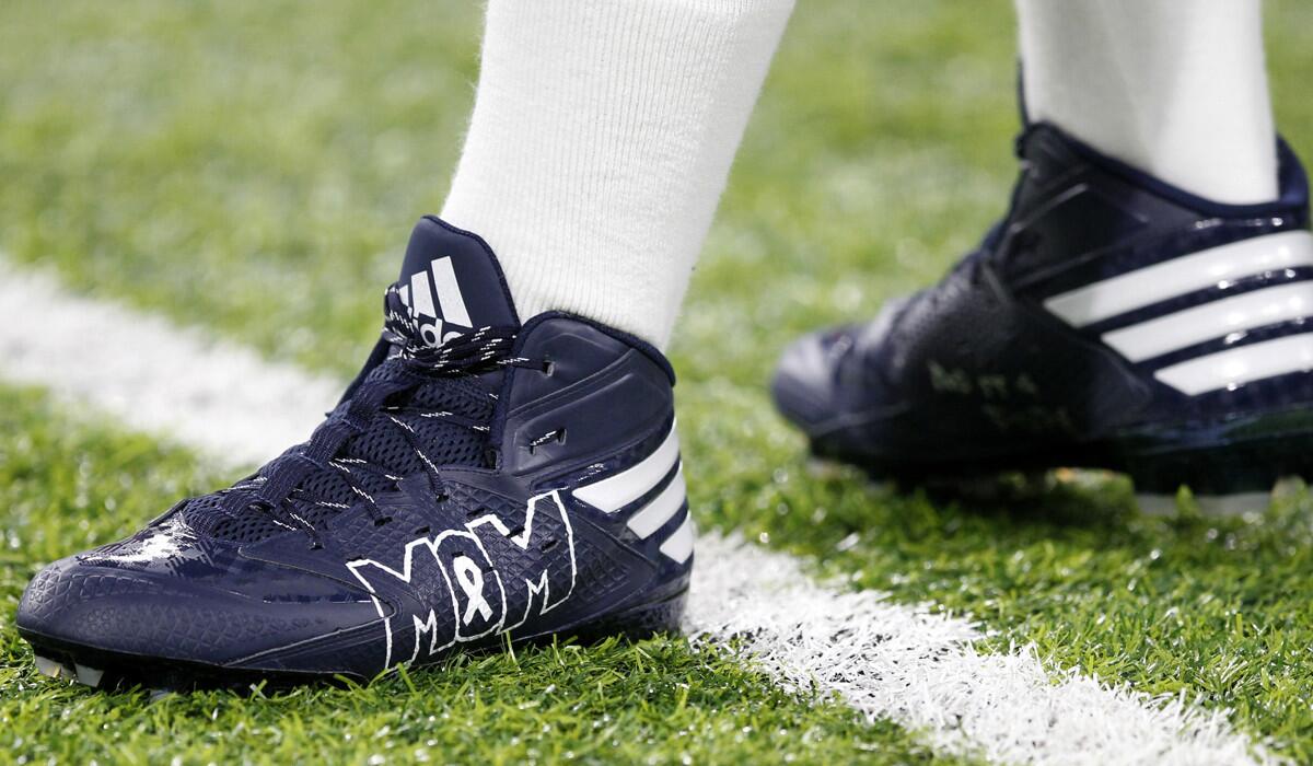 The cleats worn by quarterback Dak Prescott in the Dallas Cowboys' game against the Minnesota Vikings on Thursday promoted colon cancer prevention.