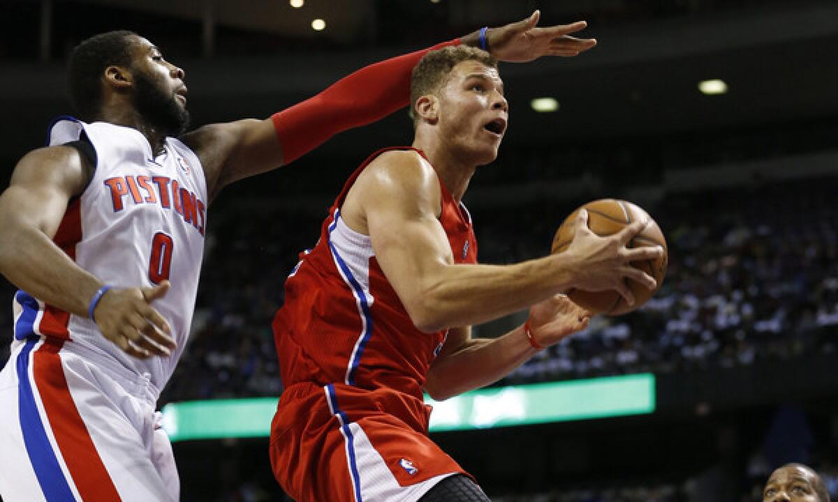 Clippers power forward Blake Griffin, right, goes up for a shot in front of Detroit's Andre Drummond during the Clippers' 112-103 win Monday.