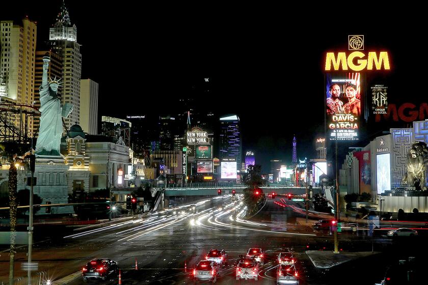 Las Vegas, NV - April 20: A sign advertising the fight between Gervonta Davis and Ryan Garcia glows high above the Las Vegas Strip in the days before the sold out match pitting two boxers with very large numbers of social media followers. (Luis Sinco / Los Angeles Times)