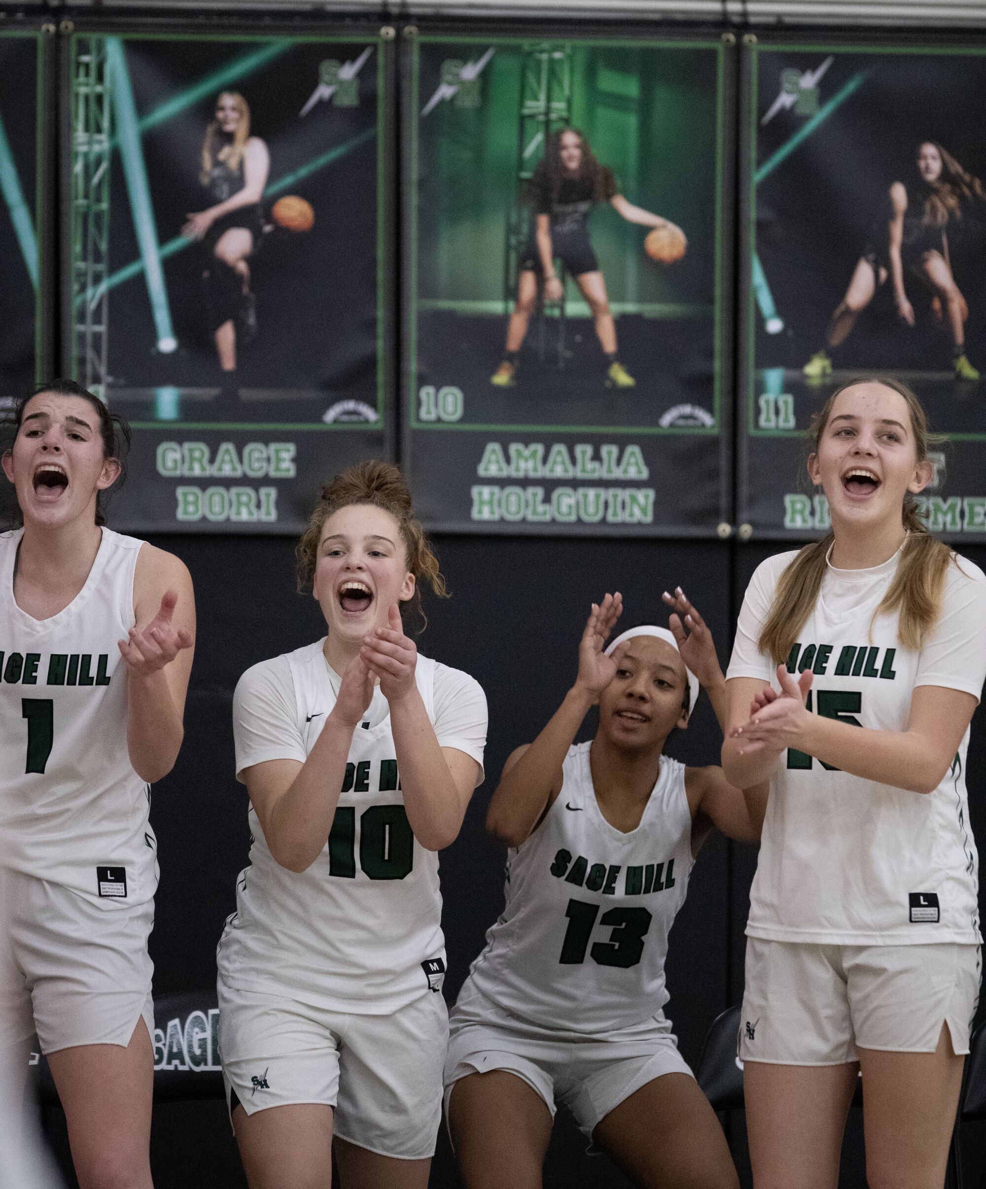 From left, Emily Eadie, Amalia Holguin, Zoie Lamkin and Annabelle Spotts cheer on their Sage Hill teammates. 