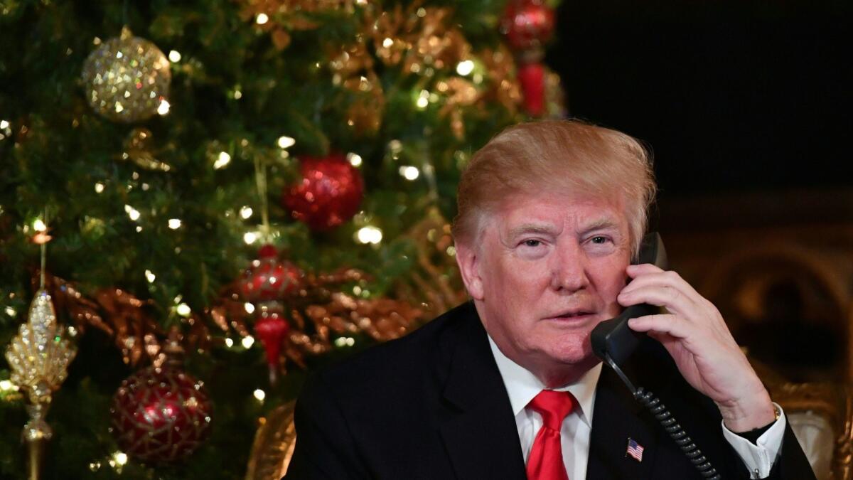 President Trump, shown at his Palm Beach, Fla., resort on Christmas Eve, had insisted the Pentagon not follow through on the Obama administration’s plan to end the ban on enlisting transgender troops in 2017.
