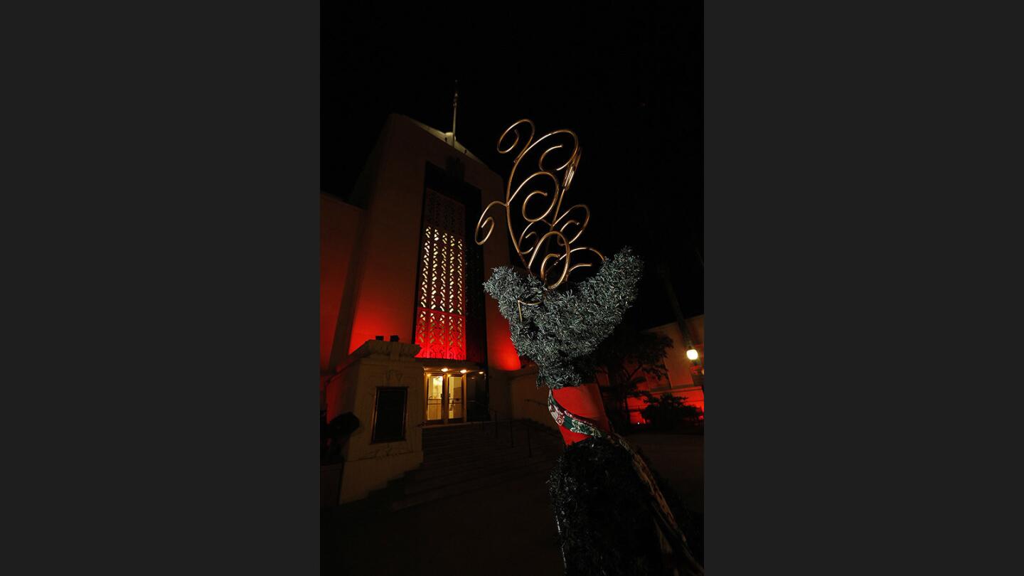 An artistic reindeer in front of Burbank City Hall illuminate in orange in support of Zonta Club on Tuesday, November 28, 2017. Burbank is supporting the Zonta Club of Burbank's campaign to raise awareness on violence against women and others. The orange hue will continue until December 10.