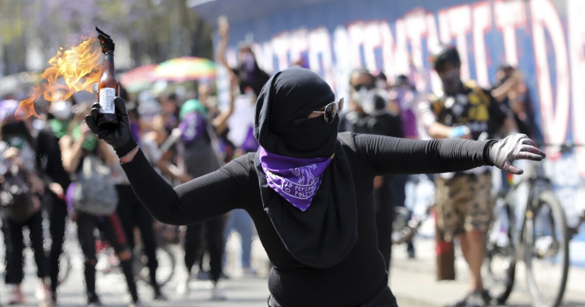 Dozens injured while feminist protesters clash with police in Mexican capital