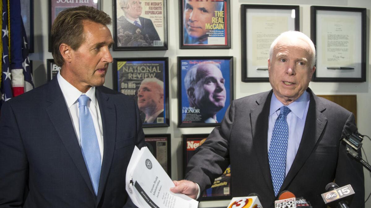 Arizona Sen. Jeff Flake, left, with the state's other senator, John McCain.