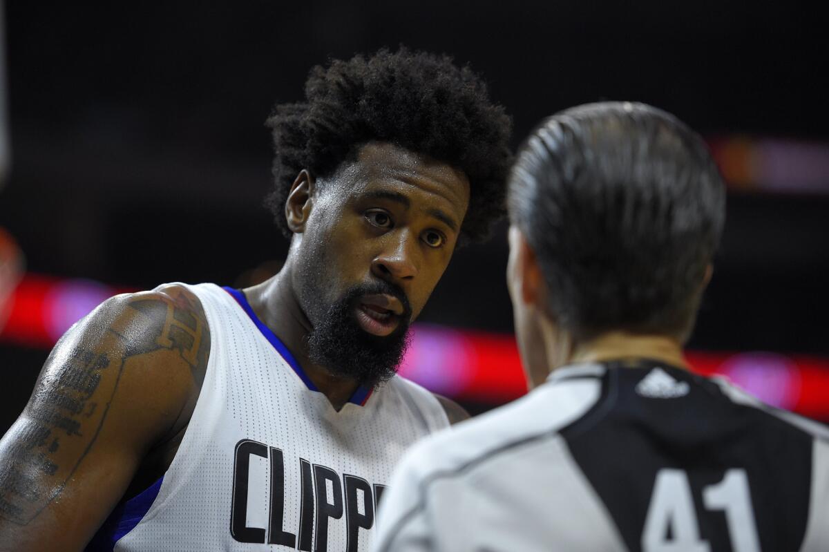 Clippers center DeAndre Jordan talks to referee Ken Mauer during the second half of a game against the Phoenix Suns on Nov. 2.
