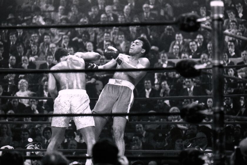 Joe Frazier attacks Muhammad Ali along the ropes during the World Heavyweight Championship at Madison Square Garden on March 8, 1971 in New York City.