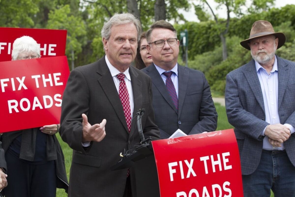 San Diego County Supervisor Jim Desmond, photographed at a rally in May, has led the charge to prevent local politicians from diverting funds from a voter-approved tax hike, known as Transnet, to rail and other transit projects.