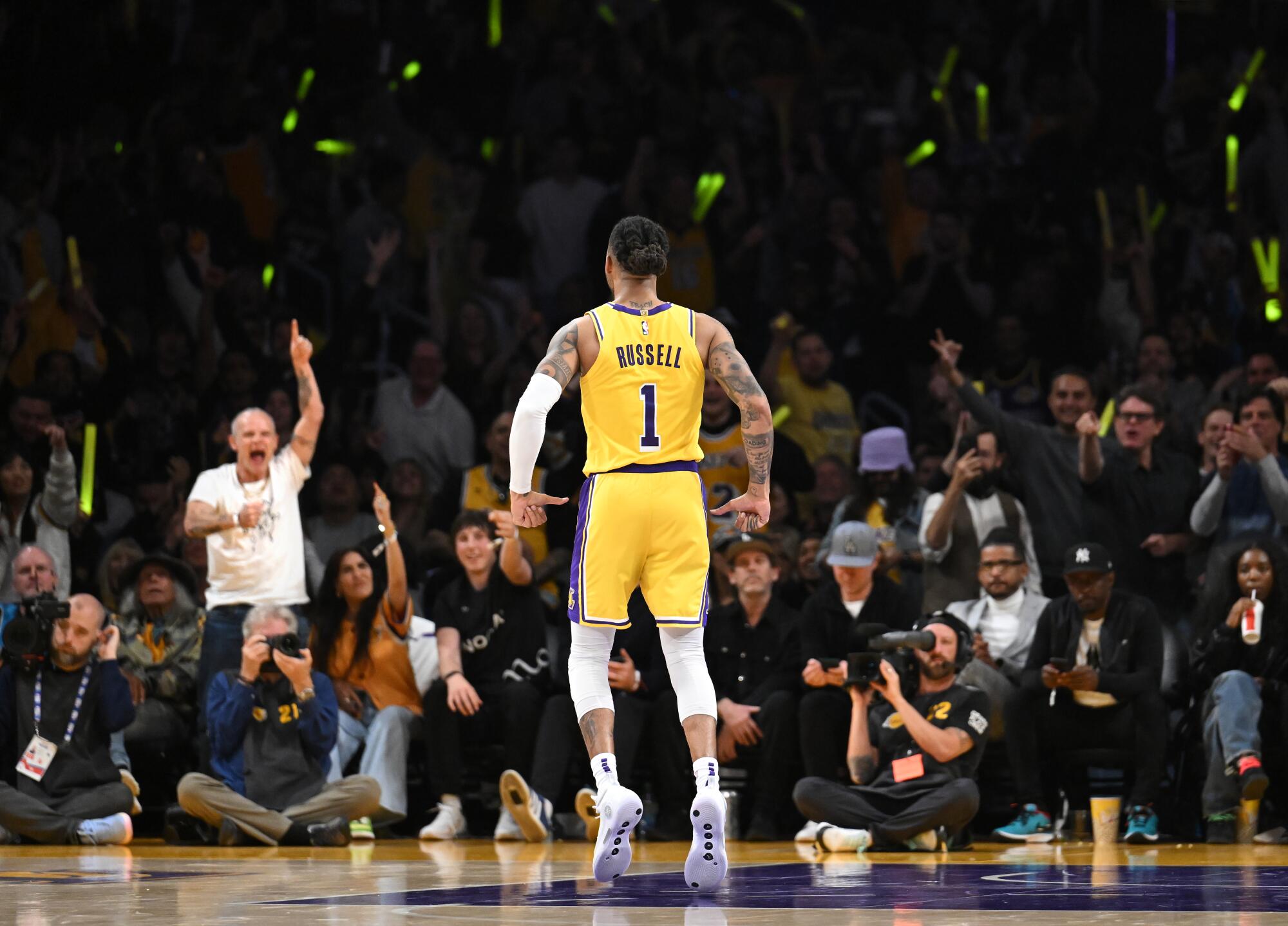 Lakers guard D'Angelo Russell celebrates a three-pointer against the Grizzlies in the third quarter.