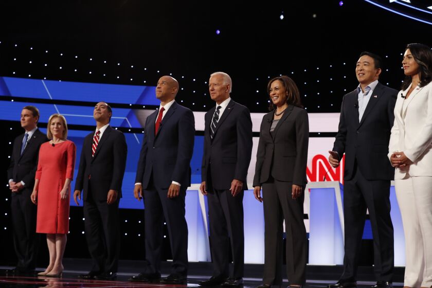 From left, Sen. Michael Bennet, D-Colo., Sen. Kirsten Gillibrand, D-N.Y., former HUD Secretary Julian Castro, Sen. Cory Booker, D-N.J., former Vice President Joe Biden, Sen. Kamala Harris, D-Calif., Andrew Yang and Rep. Tulsi Gabbard, D-Hawaii, are introduced before the second of two Democratic presidential primary debates hosted by CNN Wednesday, July 31, 2019, in the Fox Theatre in Detroit. (AP Photo/Carlos Osorio)