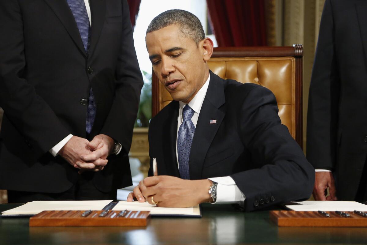 President Obama signs nominations on Capitol Hill following his inauguration ceremony.