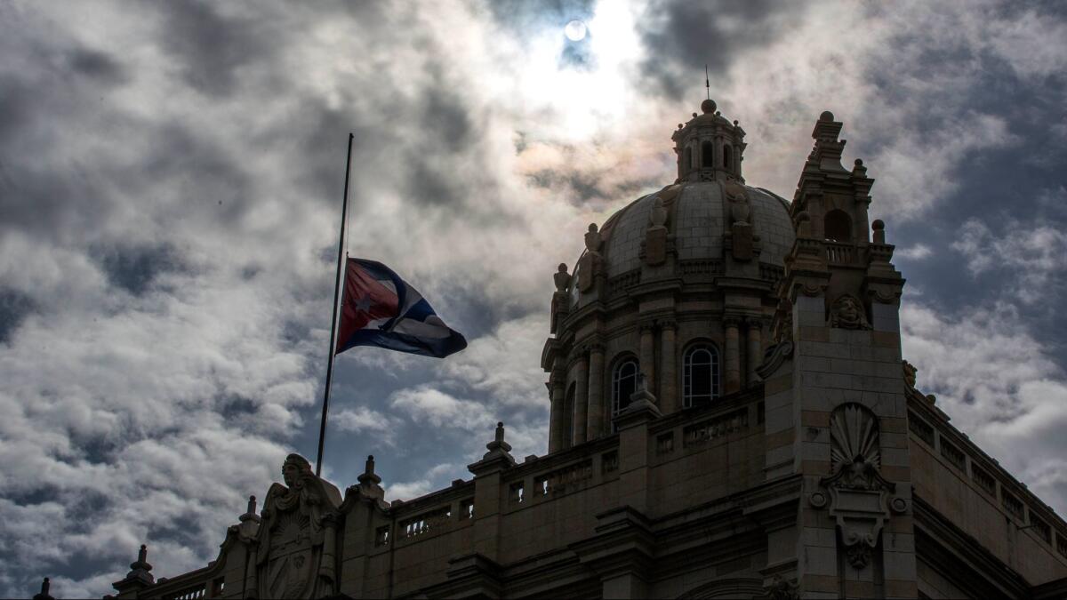 The Cuban flag flies at half-staff outside the Museum of the Revolution in Havana shortly after Castro's death.