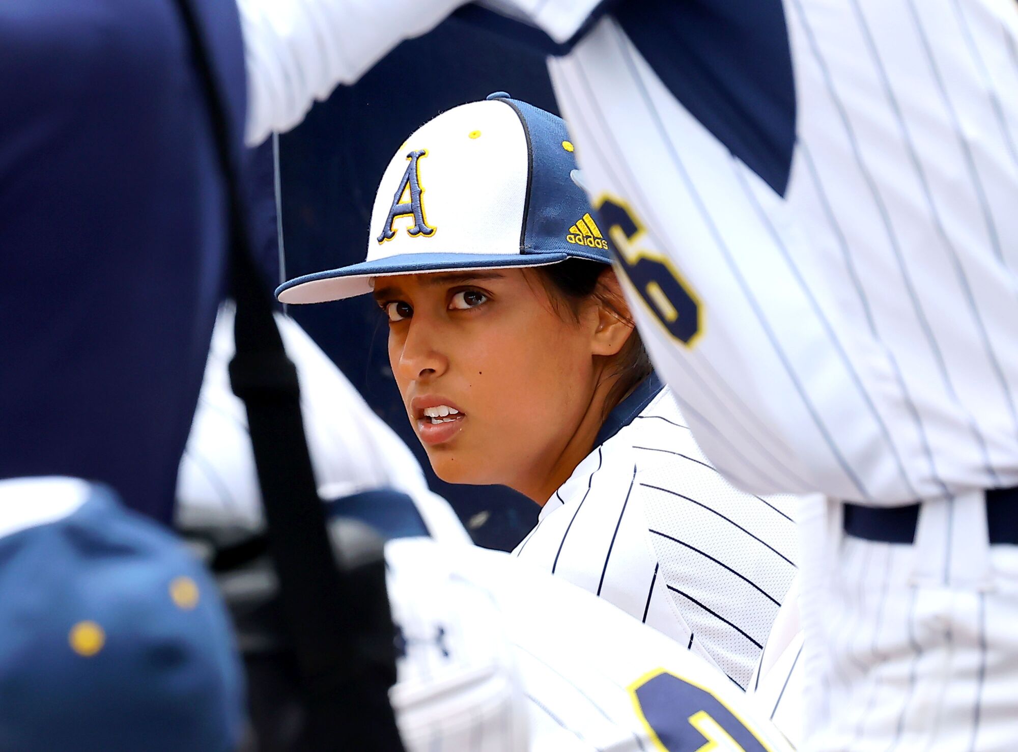 Jillian Albayati sits in the dugout with Anaheim High teammates during the Southern Section Division 6 title game.