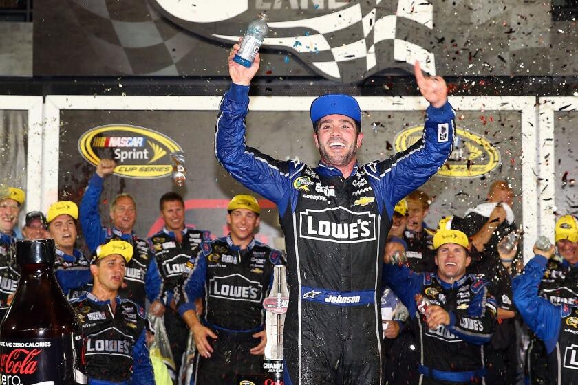 Jimmie Johnson celebrates after winning the Coke Zero 400 at Daytona.