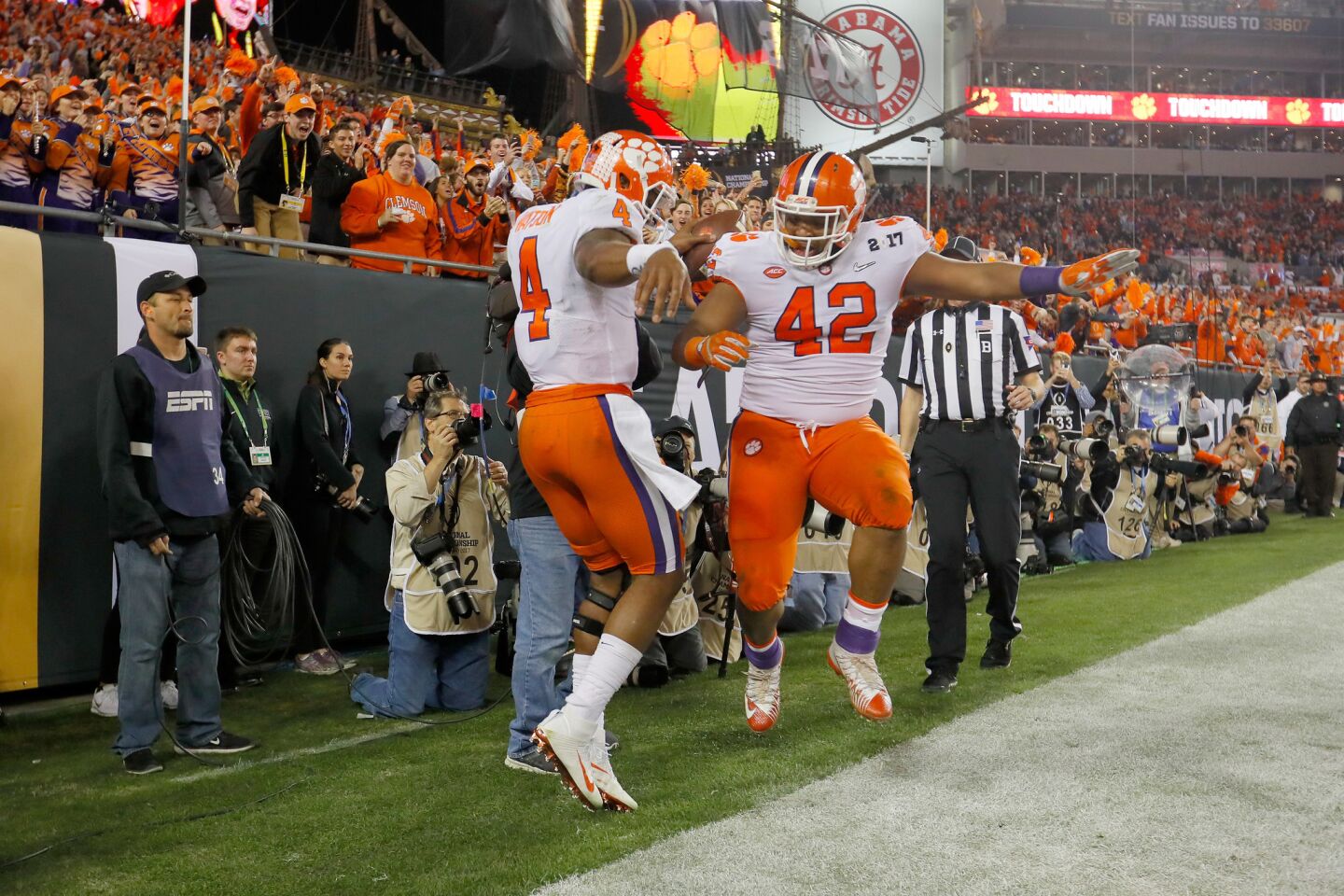 Clemson quarterback Deshaun Watson (4) celebrates with teammate Christian Wilkins (42) after rushing for an eight-yard touchdown during the second quarter.