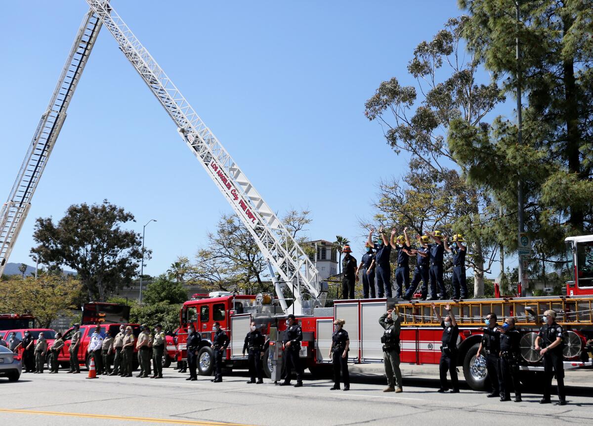 Members of the L.A. City Fire Department show their appreciation for healthcare workers at USC Verdugo Hills Hospital in an outdoor rally, Wednesday, April 15, 2020.