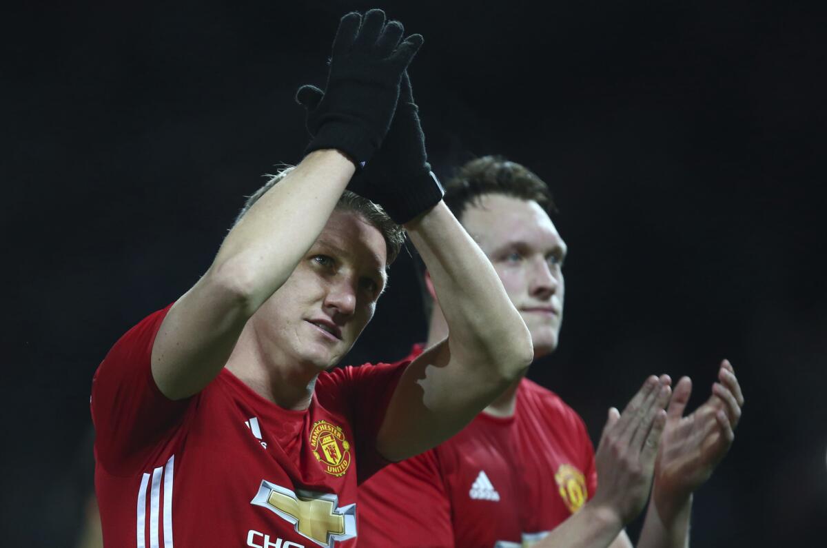Manchester United's Bastian Schweinsteiger waves to the crowd as he walks off the pitch after the end of the English League Cup quarterfinal soccer match between Manchester United and West Ham United at Old Trafford in Manchester, England Wednesday, Nov. 30, 2016. Man United won the game 4-1. (AP Photo/Dave Thompson)