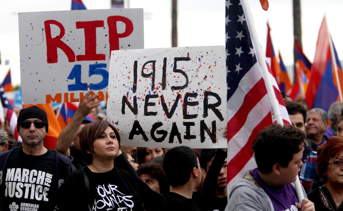 Thousands brought flags, signs and photos to the March for Justice commemorating the 100th anniversary of the Armenian Genocide, on Sunset Blvd. in Hollywood on Friday, April 24, 2015.