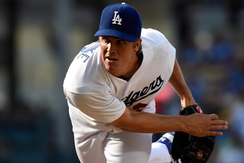 Dodgers starter Zack Greinke delivers a pitch during the first inning of Sunday's game against the Pittsburgh Pirates at Dodger Stadium.