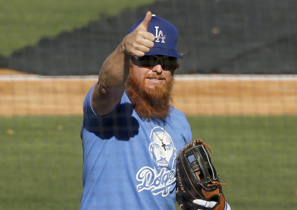 LOS ANGELES, CALIF. - JULY 3, 2020. Dodgers third baseman Justin Turner takes the field during practice at Dodger Stadium.